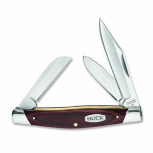 Buck Stockman non-locking pocket knife shown on white background with all three blades open. Shows steel bolsters and buck logo on brown wooden handle.